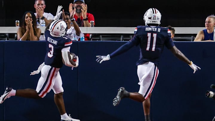 Aug 30, 2025; Tucson, Arizona, USA; Arizona Wildcats running back Kedrick Reescano (3) points up to the sky after he runs a touchdown against the Hawaii Rainbow Warriors during the first quarter of the game at Arizona Stadium. Mandatory Credit: Aryanna Frank-Imagn Images