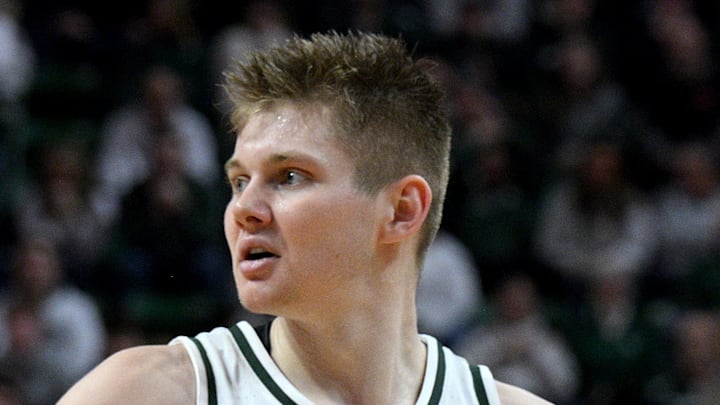 Jan 24, 2026; East Lansing, Michigan, USA;  Michigan State Spartans forward Jaxon Kohler (0) reacts to a Michigan State Spartans forward Coen Carr (55) dunk during the second half against the Maryland Terrapins at Jack Breslin Student Events Center.