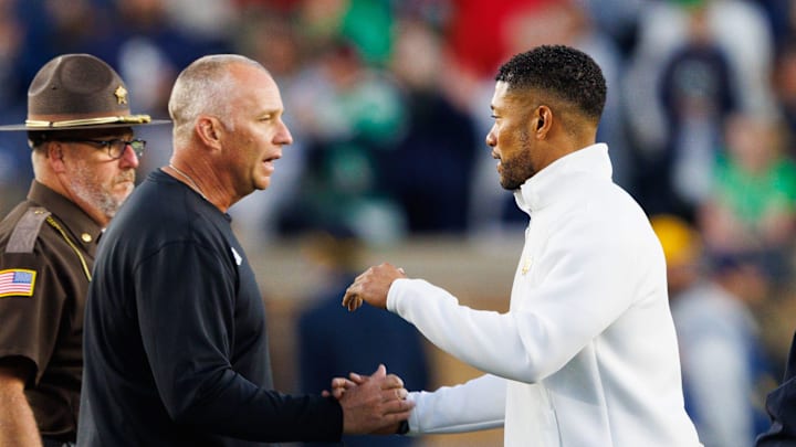 Notre Dame head coach Marcus Freeman, right, and NC State head coach Dave Doeren shake hands after Notre Dame won a NCAA football game 36-7 against NC State at Notre Dame Stadium on Saturday, Oct. 11, 2025, in South Bend. Notre Dame head coach Marcus Freeman, right, and NC State head coach Dave Doeren shake hands after Notre Dame won a NCAA football game 36-7 against NC State at Notre Dame Stadium on Saturday, Oct. 11, 2025, in South Bend.