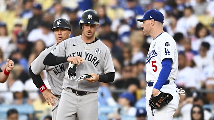 New York Yankees pinch hitter Cody Bellinger (L) and Los Angeles Dodgers first baseman Freddie Freeman