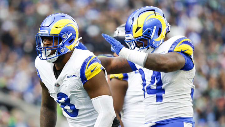 Nov 3, 2024; Seattle, Washington, USA; Los Angeles Rams linebacker Jared Verse (8) celebrates with cornerback Cobie Durant (14) after a sack against the Seattle Seahawks during the second quarter at Lumen Field. Mandatory Credit: Joe Nicholson-Imagn Images