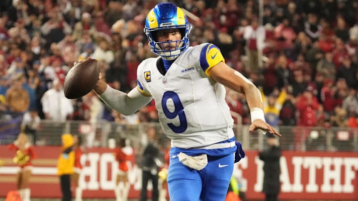 Dec 12, 2024; Santa Clara, California, USA; Los Angeles Rams quarterback Matthew Stafford (9) throws the ball in motion against the San Francisco 49ers during the fourth quarter at Levi's Stadium. Mandatory Credit: Kelley L Cox-Imagn Images