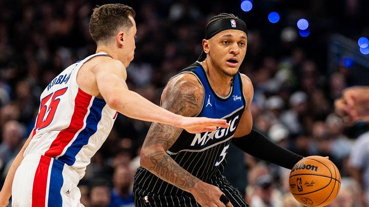 May 1, 2026; Orlando, Florida, USA; Orlando Magic forward Paolo Banchero (5) dribbles the ball against Detroit Pistons forward Duncan Robinson (55) in the fourth quarter during game six of the first round of the 2026 NBA Playoffs at Kia Center. Mandatory Credit: Jeremy Reper-Imagn Images