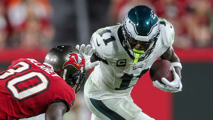 Sep 25, 2023; Tampa, Florida, USA;  Philadelphia Eagles wide receiver A.J. Brown (11) holds off Tampa Bay Buccaneers cornerback Dee Delaney (30) in the third quarter at Raymond James Stadium. Mandatory Credit: Nathan Ray Seebeck-Imagn Images