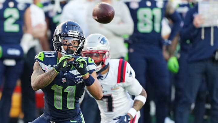 Seattle Seahawks wide receiver Jaxon Smith-Njigba (11) makes a catch against New England Patriots cornerback Carlton Davis III (7)