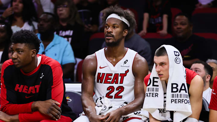 Oct 13, 2024; Miami, Florida, USA; Miami Heat forward Jimmy Butler (22) watches from the bench against the New Orleans Pelicans during the second quarter at Kaseya Center. Mandatory Credit: Sam Navarro-Imagn Images