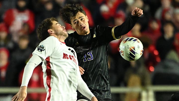 Dec 15, 2025; Cary, NC, USA; Washington Huskies defender Conner Leber (22) and Washington Huskies midfielder Kevin Hernandez (13) fight for the ball in the second half at First Horizon Stadium. Mandatory Credit: Bob Donnan-Imagn Images Dec 15, 2025; Cary, NC, USA; Washington Huskies defender Conner Leber (22) and Washington Huskies midfielder Kevin Hernandez (13) fight for the ball in the second half at First Horizon Stadium. Mandatory Credit: Bob Donnan-Imagn Images