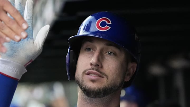 Oct 2, 2025; Chicago, Illinois, USA; Chicago Cubs outfielder Kyle Tucker (30) is greeted in the dugout after scoring against the San Diego Padres during game three of the Wildcard round for the 2025 MLB playoffs at Wrigley Field. Mandatory Credit: David Banks-Imagn Images