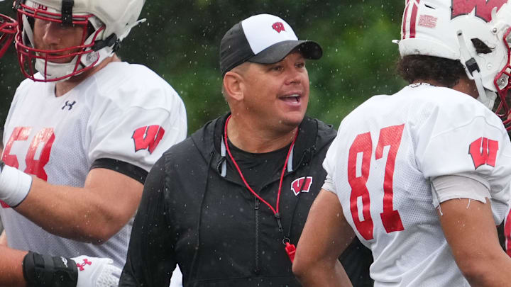 Wisconsin football offensive line coach AJ Blazek works with players during practice Wednesday, July 30, 2025, at Ralph E. Davis Pioneer Stadium in Platteville, Wisconsin.
