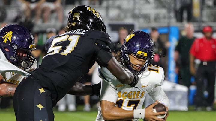 North Carolina A&T Aggies quarterback Braxton Thomas (17) is tackled by UCF Knights edge Malachi Lawrence (51)