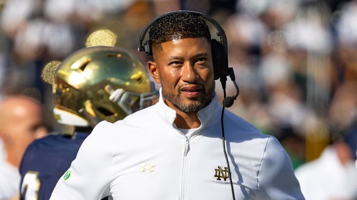 Oct 11, 2025; South Bend, Indiana, USA; Notre Dame Fighting Irish head coach Marcus Freeman looks to the scoreboard against the NC State Wolfpack during the first half at Notre Dame Stadium. 