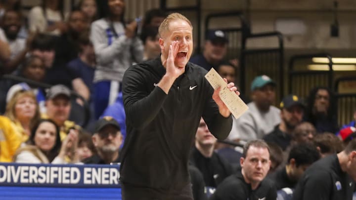 Feb 28, 2026; Morgantown, West Virginia, USA; BYU Cougars head coach Kevin Young yells from the sideline during the first half against the West Virginia Mountaineers at Hope Coliseum. Mandatory Credit: Ben Queen-Imagn Images
