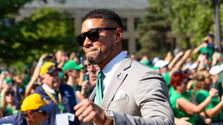 Oct 4, 2025; South Bend, Indiana, USA; Notre Dame Fighting Irish head coach Marcus Freeman gives a thumbs up to fans while walking to the stadium before a game against the Boise State Broncos at Notre Dame Stadium. Mandatory Credit: Michael Caterina-Imagn Images