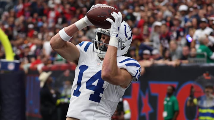 Jan 4, 2026; Houston, Texas, USA;  Indianapolis Colts wide receiver Alec Pierce (14) catches a touchdown pass against the Houston Texans during the first half at NRG Stadium. Mandatory Credit: Thomas Shea-Imagn Images