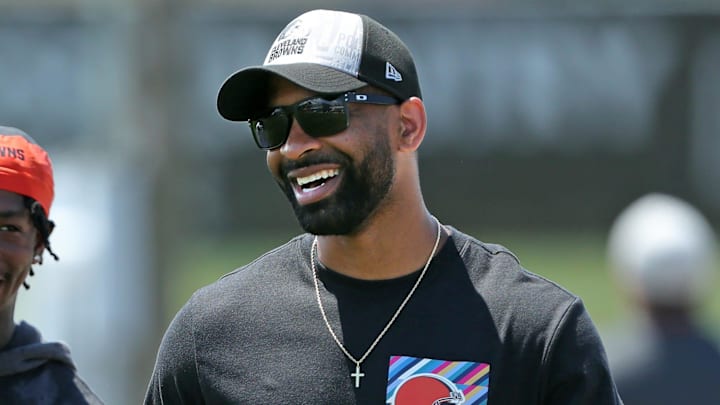 Browns general manager Andrew Berry, right, shares a laugh with cornerback Justin Hardee Sr. after minicamp practice, Thursday, June 13, 2024, in Berea.
