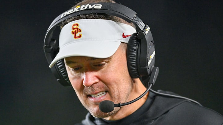 Oct 14, 2023; South Bend, Indiana, USA; USC Trojans head coach Lincoln Riley talks on his headset in the third quarter against the Notre Dame Fighting Irish at Notre Dame Stadium. Mandatory Credit: Matt Cashore-Imagn Images