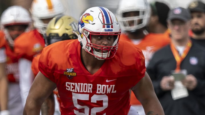 Jan 28, 2025; Mobile, AL, USA; American team offensive lineman Logan Brown of Kansas (52) sets up to block during Senior Bowl practice for the American team at Hancock Whitney Stadium. Mandatory Credit: Vasha Hunt-Imagn Images