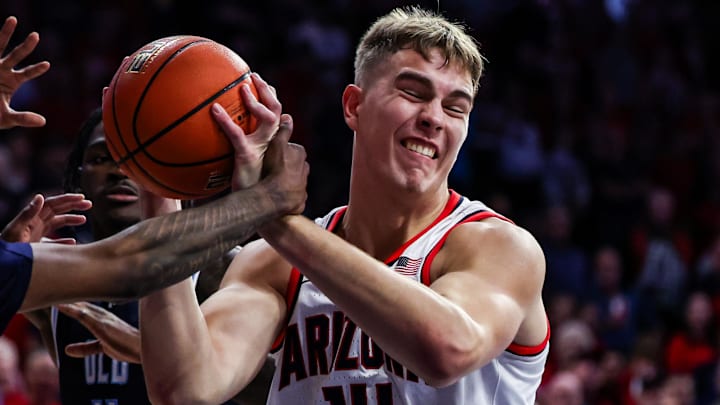 Nov 9, 2024; Tucson, Arizona, USA; Old Dominion Monarchs guard Devin Ceaser (13) fouls Arizona Wildcats center Motiejus Krivas (14) during the second half at McKale Center. Mandatory Credit: Aryanna Frank-Imagn Images Nov 9, 2024; Tucson, Arizona, USA; Old Dominion Monarchs guard Devin Ceaser (13) fouls Arizona Wildcats center Motiejus Krivas (14) during the second half at McKale Center. Mandatory Credit: Aryanna Frank-Imagn Images