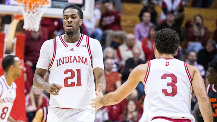 Indiana's Mackenzie Mgbako (21) high fives Anthony Leal (3) at Simon Skjodt Assembly Hall. 