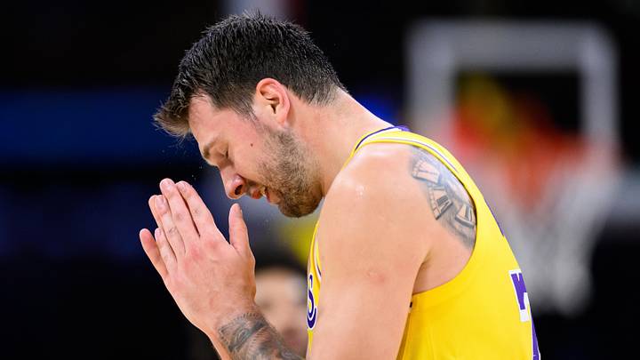 Mar 14, 2026; Los Angeles, California, USA; Los Angeles Lakers guard Luka Doncic (77) reacts after missing a shot during the first half against the Denver Nuggets at Crypto.com Arena. Mandatory Credit: William Liang-Imagn Images
