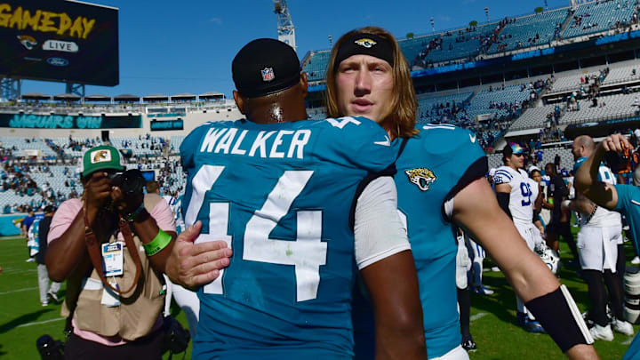 Jacksonville Jaguars quarterback Trevor Lawrence (16) hugs teammate linebacker Travon Walker (44) after Sunday's victory over the Indianapolis Colts. The Jacksonville Jaguars hosted the Indianapolis Colts at EverBank Stadium in Jacksonville, FL Sunday, October 15, 2023. The Jaguars ended the first half with a 21 to 6 lead and won with a final score of 37 to 20.