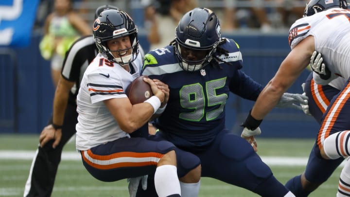 Aug 18, 2022; Seattle, Washington, USA; Seattle Seahawks defensive tackle Myles Adams (95) sacks Chicago Bears quarterback Trevor Siemian (15) during the second quarter at Lumen Field. Mandatory Credit: Joe Nicholson-USA TODAY Sports