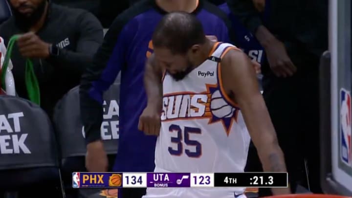 Kevin Durant celebrates after a made three by teammate Royce O’Neal.