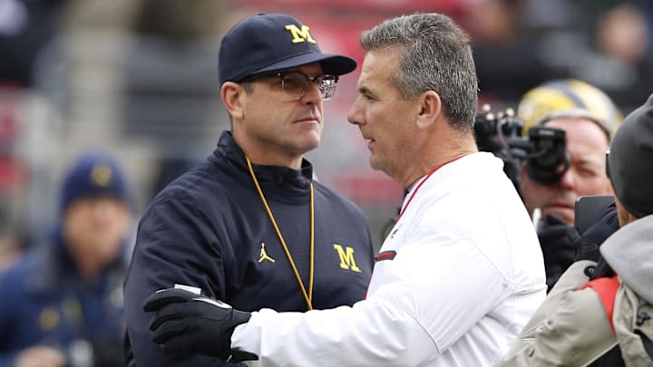 Nov 26, 2016; Columbus, OH, USA;  Michigan Wolverines head coach Jim Harbaugh and Ohio State Buckeyes head coach Urban Meyer shake hands before the game at Ohio Stadium. Mandatory Credit: Joe Maiorana-Imagn Images