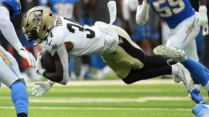 Aug 10, 2025; Inglewood, California, USA; New Orleans Saints running back Marcus Yarns (34) is tackled in the fourth quarter against the Los Angeles Chargers at SoFi Stadium. Aug 10, 2025; Inglewood, California, USA; New Orleans Saints running back Marcus Yarns (34) is tackled in the fourth quarter against the Los Angeles Chargers at SoFi Stadium.
