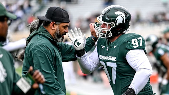 Michigan State's Maverick Hansen, right, works with defensive line coach Legi Suiaunoa during the Spring Showcase on Saturday, April 20, 2024, at Spartan Stadium in East Lansing.