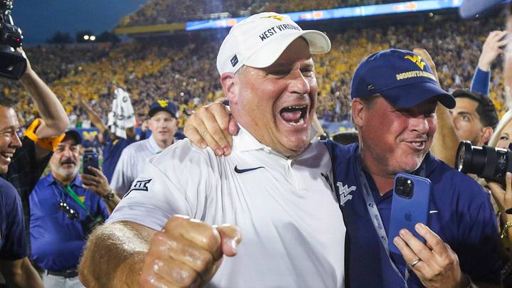 Sep 13, 2025; Morgantown, West Virginia, USA; West Virginia Mountaineers head coach Rich Rodriguez celebrates after defeating the Pittsburgh Panthers at Milan Puskar Stadium. Mandatory Credit: Ben Queen-Imagn Images