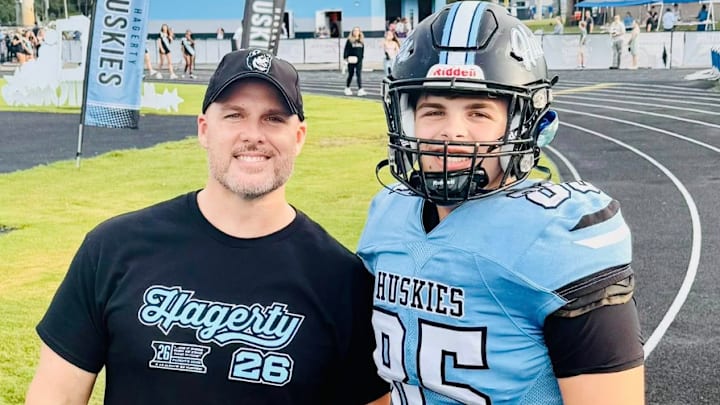 A chip off of the old block, Adam (left) officially has someone to look up to in 6-foot-3, Jacob (right) at Hagerty High School. 