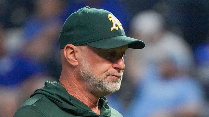Aug 19, 2026; Kansas City, Missouri, USA; Athletics manager Mark Kotsay (7) returns to the dugout after a pitching change against the Kansas City Royals during the sixth inning at Kauffman Stadium. Mandatory Credit: Denny Medley-Imagn Images