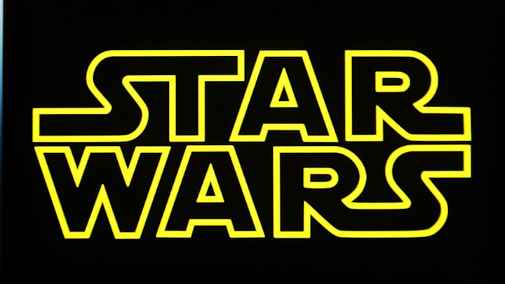 In this photo illustration, a Star Wars logo is seen on a...