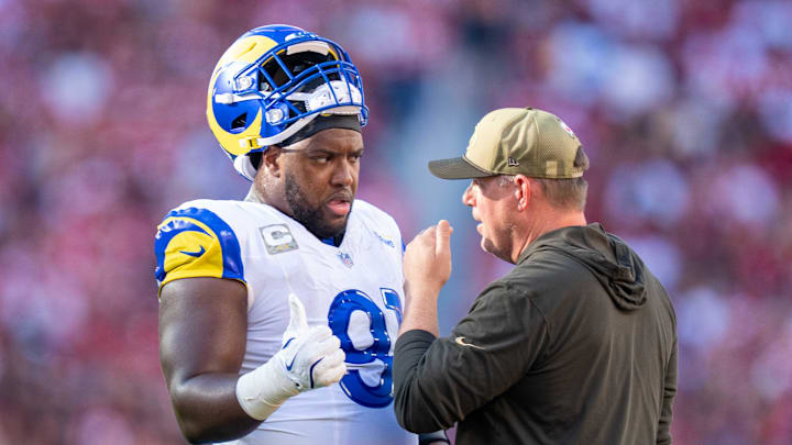 November 9, 2025; Santa Clara, California, USA; Los Angeles Rams defensive end Kobie Turner (91) and defensive line coach Giff Smith (right) during the second quarter against the San Francisco 49ers at Levi's Stadium. Mandatory Credit: Kyle Terada-Imagn Images November 9, 2025; Santa Clara, California, USA; Los Angeles Rams defensive end Kobie Turner (91) and defensive line coach Giff Smith (right) during the second quarter against the San Francisco 49ers at Levi's Stadium. Mandatory Credit: Kyle Terada-Imagn Images