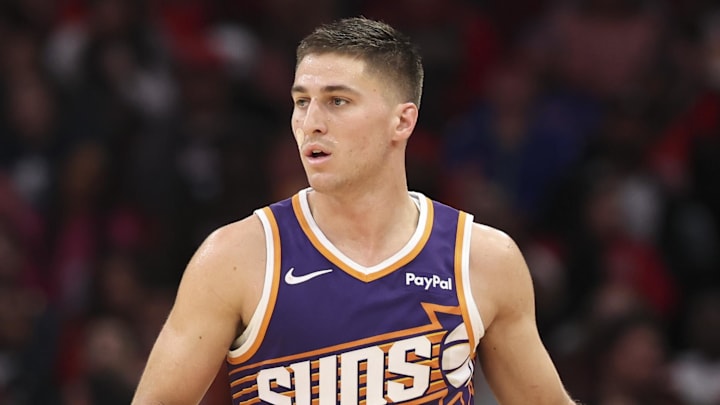 Dec 5, 2025; Houston, Texas, USA; Phoenix Suns guard Collin Gillespie (12) dribbles the ball during the fourth quarter against the Houston Rockets at Toyota Center. Mandatory Credit: Troy Taormina-Imagn Images