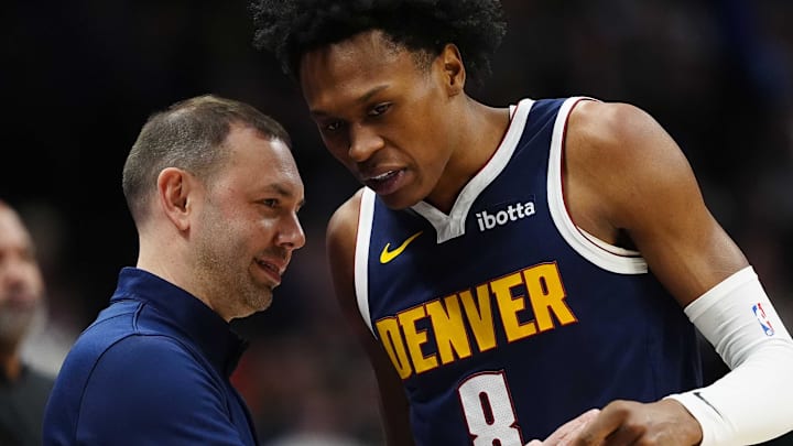 Jan 27, 2026; Denver, Colorado, USA; Denver Nuggets guard Peyton Watson (8) talks to head coach David Adelman during the first quarter against the Detroit Pistons at Ball Arena. Mandatory Credit: Ron Chenoy-Imagn Images