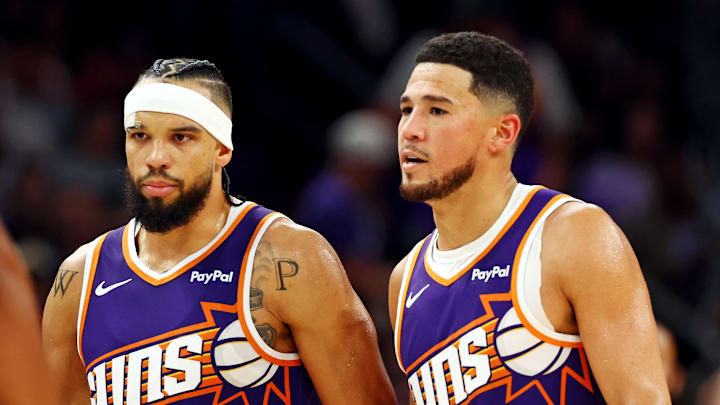 Oct 22, 2025; Phoenix, Arizona, USA; Phoenix Suns guard Devin Booker (1) and forward Dillon Brooks (3) during the second half against the Sacramento Kings at the Mortgage Matchup Center. Mandatory Credit: Mark J. Rebilas-Imagn Images
