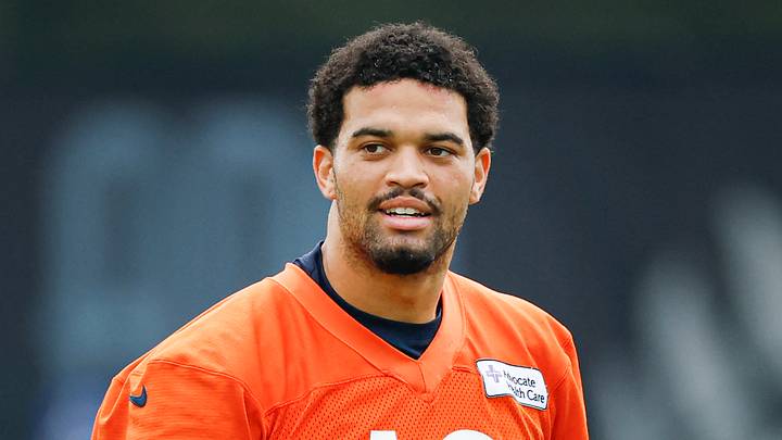 Chicago Bears quarterback Caleb Williams (18) stands on the field during training camp