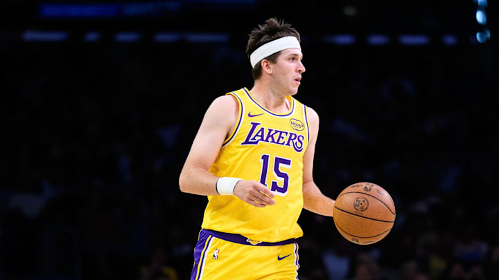 Mar 14, 2026; Los Angeles, California, USA; Los Angeles Lakers guard Austin Reaves (15) controls the ball during the first half against the Denver Nuggets at Crypto.com Arena. Mandatory Credit: William Liang-Imagn Images