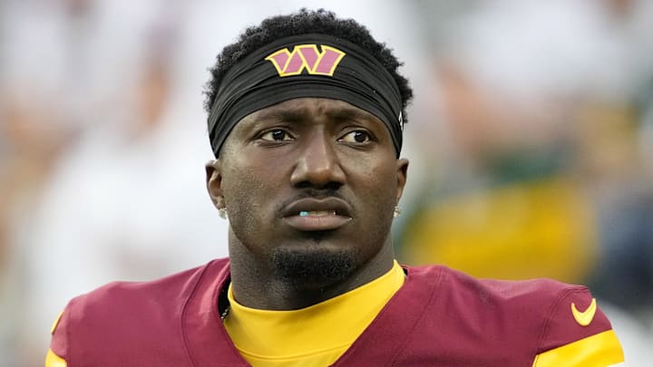 Sep 11, 2025; Green Bay, Wisconsin, USA; Washington Commanders wide receiver Deebo Samuel (1) looks on before a game against the Green Bay Packers at Lambeau Field. Mandatory Credit: Jeff Hanisch-Imagn Images