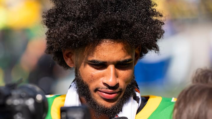 Oregon quarterback Dante Moore speaks to a television reporter as the Oregon Ducks host the Montana State Bobcats on Aug. 30, 2025, at Autzen Stadium in Eugene, Oregon.