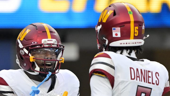 Oct 5, 2025; Inglewood, California, USA; Washington Commanders quarterback Jayden Daniels (5) celebrates with wide receiver Deebo Samuel Sr. (1) after a touchdown against the Los Angeles Chargers in the second half at SoFi Stadium. Mandatory Credit: Jayne Kamin-Oncea-Imagn Images Oct 5, 2025; Inglewood, California, USA; Washington Commanders quarterback Jayden Daniels (5) celebrates with wide receiver Deebo Samuel Sr. (1) after a touchdown against the Los Angeles Chargers in the second half at SoFi Stadium. Mandatory Credit: Jayne Kamin-Oncea-Imagn Images