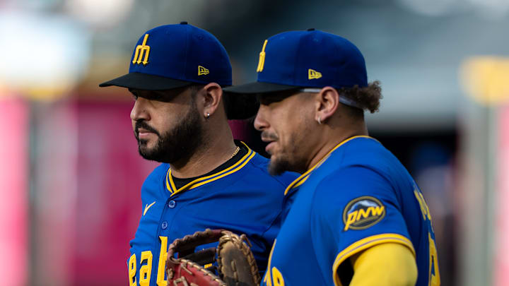 Seattle Mariners infielders Eugenio Suarez, Josh Naylor Seattle Mariners infielders Eugenio Suarez, Josh Naylor