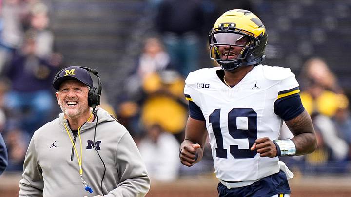 Michigan head coach Kyle Whittingham, left, and quarterback Bryce Underwood Michigan head coach Kyle Whittingham, left, and quarterback Bryce Underwood