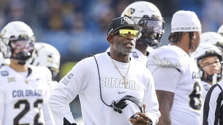 Nov 8, 2025; Morgantown, West Virginia, USA; Colorado Buffaloes head coach Deion Sanders watches the big screen during a replay during the first quarter against the West Virginia Mountaineers at Milan Puskar Stadium. 