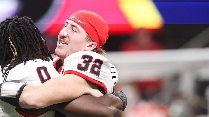 Dec 6, 2025; Atlanta, GA, USA; Georgia Bulldogs running back Roderick Robinson II (0) celebrates with Georgia Bulldogs running back Cash Jones (32) after the game against the Alabama Crimson Tide during the 2025 SEC Championship game at Mercedes-Benz Stadium. Mandatory Credit: Brett Davis-Imagn Images