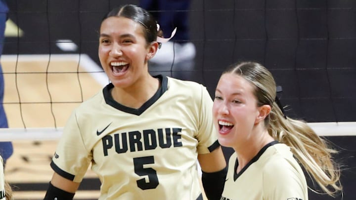 Purdue Boilermakers setter Taylor Anderson (5) and outside hitter Kenna Wollard (4)