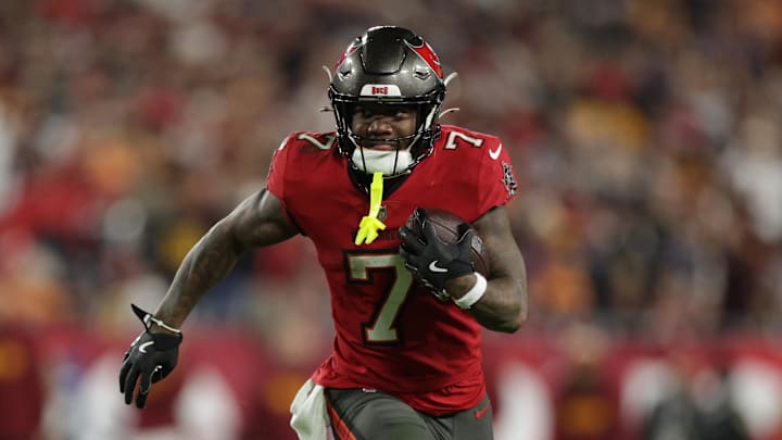 Tampa Bay Buccaneers running back Bucky Irving (7) runs during the fourth quarter of a NFC wild card playoff.