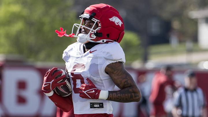 Arkansas Razorbacks wide receiver Chris Marshall (6) runs after a catch during a passing drill during spring practice at the Arkansas Razorbacks practice facilities. Arkansas Razorbacks wide receiver Chris Marshall (6) runs after a catch during a passing drill during spring practice at the Arkansas Razorbacks practice facilities.